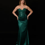 Dazzling green mermaid gown featuring a beaded corset bodice, thigh-high slit, and elegant train.