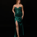 Dazzling green mermaid gown featuring a beaded corset bodice, thigh-high slit, and elegant train.