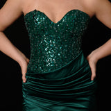 Dazzling green mermaid gown featuring a beaded corset bodice, thigh-high slit, and elegant train.