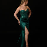 Dazzling green mermaid gown featuring a beaded corset bodice, thigh-high slit, and elegant train.