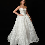 lace ballgown wedding dress featuring dramatic hips, corsetry, and timeless royal elegance for hire