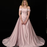 baby pink ballgown with elegant draping and a timeless silhouette.