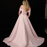 baby pink ballgown with elegant draping and a timeless silhouette.