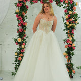 Light champagne wedding ballgown featuring a straight neckline, delicate beaded straps, sheer sparkling bodice, basque waistline, and corset back for hire