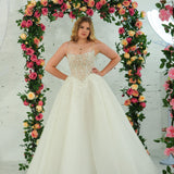 white wedding ballgown featuring a straight neckline, delicate beaded straps, sheer sparkling bodice, basque waistline, and corset back.
