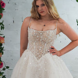 Light champagne wedding ballgown featuring a straight neckline, delicate beaded straps, sheer sparkling bodice, basque waistline, and corset back for hire