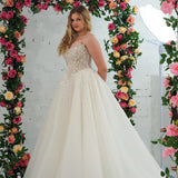Light champagne wedding ballgown featuring a straight neckline, delicate beaded straps, sheer sparkling bodice, basque waistline, and corset back for hire