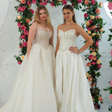 Light champagne wedding ballgown featuring a straight neckline, delicate beaded straps, sheer sparkling bodice, basque waistline, and corset back for hire