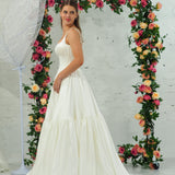 white wedding ballgown with straight neckline, basque waist, corset back, and layered skirt for hire
