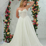 white lace ballgown featuring a strapless sweetheart neckline, basque waistline, corset back, and voluminous crinoline skirt
