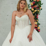 white lace ballgown featuring a strapless sweetheart neckline, basque waistline, corset back, and voluminous crinoline skirt