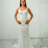 mermaid gown with beaded fabric, low back, buttons, and train.