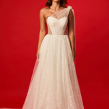 One-shoulder corset gown with tulle drape.