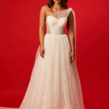 One-shoulder corset gown with tulle drape.