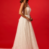 One-shoulder corset gown with tulle drape.