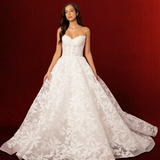 Lace print dress with a structured corset back and a long ball gown style flowing skirt for hire