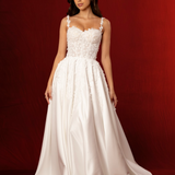 A-line dress in satin featuring 3D floral details, structured bustier cups, straps, and a corset back