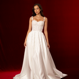 A-line dress in satin featuring 3D floral details, structured bustier cups, straps, and a corset back