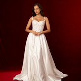 A-line dress in satin featuring 3D floral details, structured bustier cups, straps, and a corset back