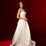 A-line dress in satin featuring 3D floral details, structured bustier cups, straps, and a corset back