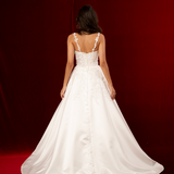 A-line dress in satin featuring 3D floral details, structured bustier cups, straps, and a corset back