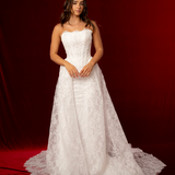 This elegant mermaid wedding dress features a strapless straight cup design, fitted corset bodice, delicate lace fabric, and a detachable lace train