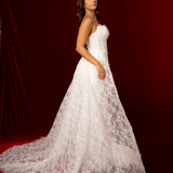 This elegant mermaid wedding dress features a strapless straight cup design, fitted corset bodice, delicate lace fabric, and a detachable lace train