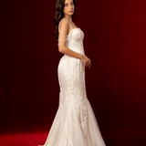 elegant mermaid gown with corset back, beaded off-shoulder details, lace and satin fabric, subtle straps, and a detachable train for hire