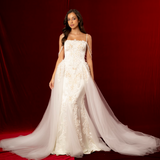 elegant mermaid gown with corset back, beaded off-shoulder details, lace and satin fabric, subtle straps, and a detachable train for hire