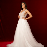 A-line design with delicate beading on bodice flowing into skirt, open back, zip closure, soft tulle layers for hire