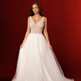 A-line design with delicate beading on bodice flowing into skirt, open back, zip closure, soft tulle layers for hire