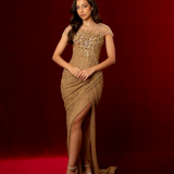 long mermaid gown with a boned corset, mesh sleeves, sequins, beads, crystals, and ruched fabric for hire