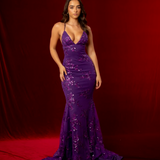 purple mermaid gown with a plunging neckline, criss-cross back, straight waist, and tulle layers.