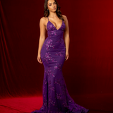 purple mermaid gown with a plunging neckline, criss-cross back, straight waist, and tulle layers.
