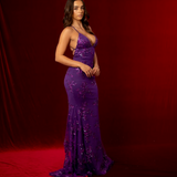 purple mermaid gown with a plunging neckline, criss-cross back, straight waist, and tulle layers.