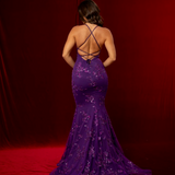 purple mermaid gown with a plunging neckline, criss-cross back, straight waist, and tulle layers.