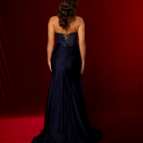 dark blue mermaid gown featuring a sweetheart neckline, beaded corset bodice, ruched satin, and a thigh-high slit.