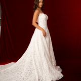 strapless A-line gown with deep V neckline, lace detailing, and a dramatic train fore hire