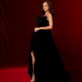 sleeveless black ball gown with a boned corset, sweetheart neckline, and layered tulle skirt for hire