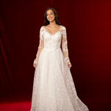 romantic A-line gown with lace sleeves, sweetheart neckline, and delicate shimmer