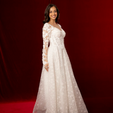 romantic A-line gown with lace sleeves, sweetheart neckline, and delicate shimmer