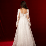 romantic A-line gown with lace sleeves, sweetheart neckline, and delicate shimmer