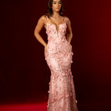 Baby pink mermaid gown with plunging V neckline, exposed corset boning, and silver glitter floral appliqué.