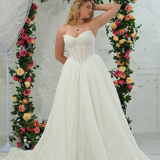 white lace ballgown featuring a strapless sweetheart neckline, basque waistline, corset back, and voluminous crinoline skirt