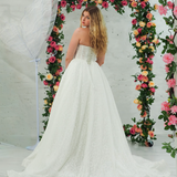 white lace ballgown featuring a strapless sweetheart neckline, basque waistline, corset back, and voluminous crinoline skirt