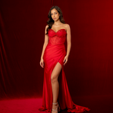 Red mermaid gown featuring a sweetheart neckline, beaded corset bodice, ruched satin, and a thigh-high slit.