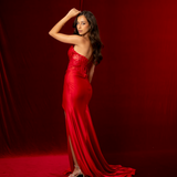 Red mermaid gown featuring a sweetheart neckline, beaded corset bodice, ruched satin, and a thigh-high slit.