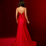 Red mermaid gown featuring a sweetheart neckline, beaded corset bodice, ruched satin, and a thigh-high slit.