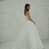 lace ballgown wedding dress featuring dramatic hips, corsetry, and timeless royal elegance