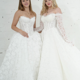 lace ballgown wedding dress featuring dramatic hips, corsetry, and timeless royal elegance
